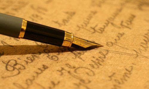 Fountain pen on old letter